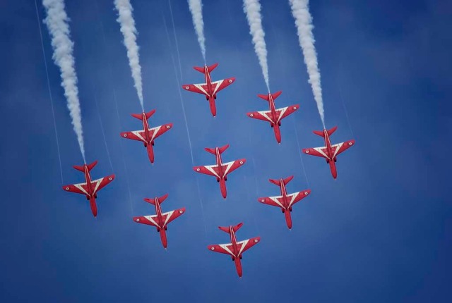 The famous Royal Air Force Red Arrows flying in Diamond Nine Formation